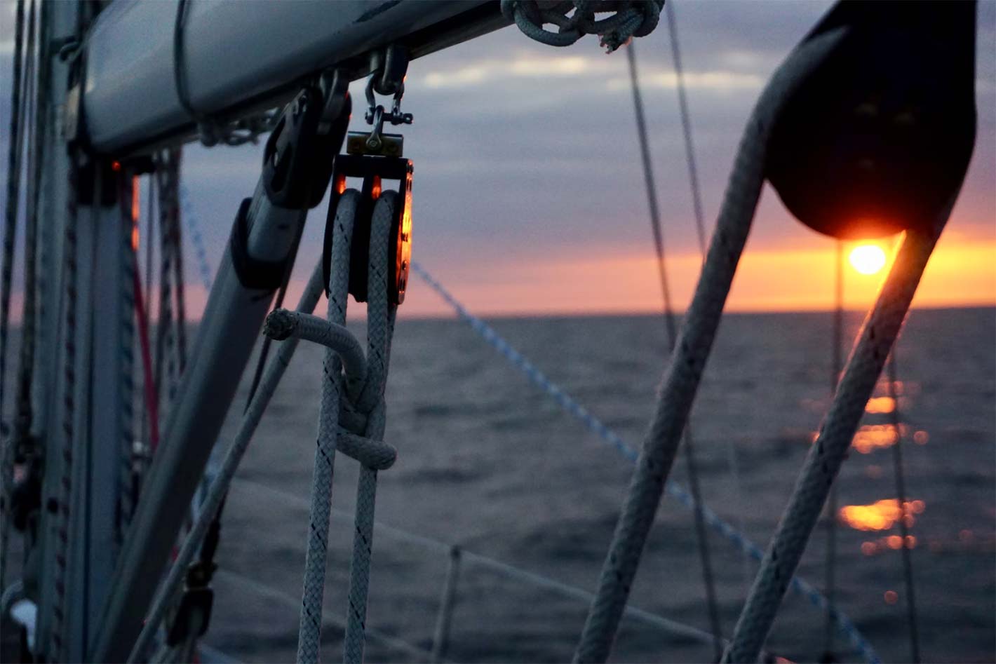 sailing boom beam ropes sunset